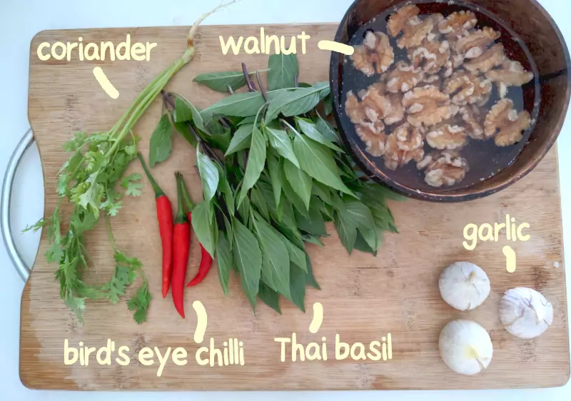 pesto ingredients as laid out on a chopping board